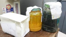 Những lọ bột tạo màu thu giữ được trong chuyên án. Ảnh: Trọng Đức