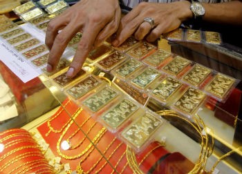 Giá vàng có thể về vùng 705USD/ouce vào quãng cuối quý III đầu quý IV năm 2014?